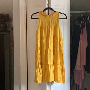 Yellow ruffle neck tie in the back dress